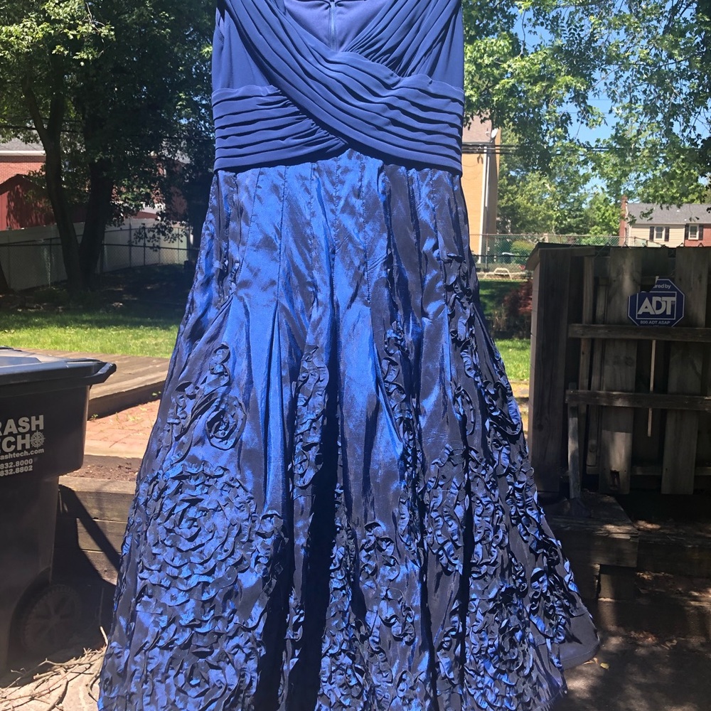 A blue dress with floral patterns